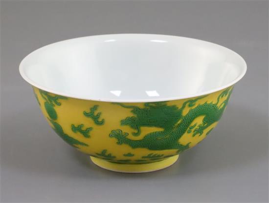 A Chinese yellow and green enamelled dragon bowl, Qianlong seal mark and of the period (1736-95) D. 15.5cm, faults